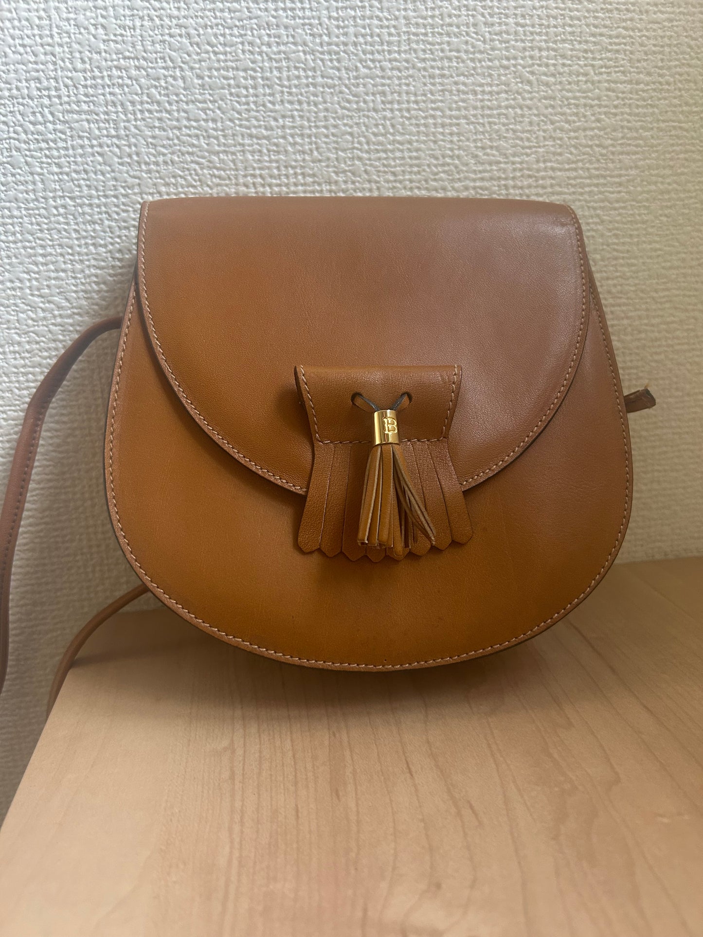 Bally Warm Brown Half Moon Tassel Sling