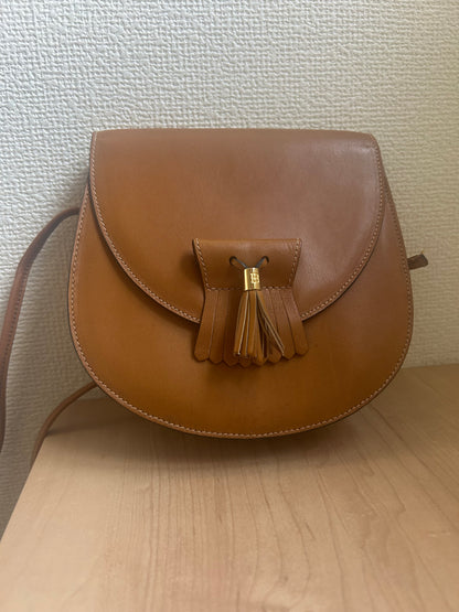 Bally Warm Brown Half Moon Tassel Sling